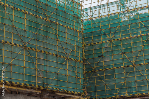 Metal scaffolding fence network for high-rise buildings under construction in China