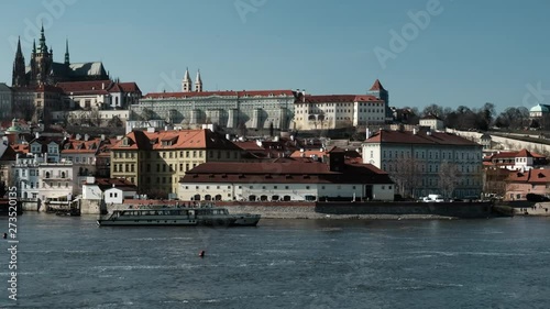 Boats deliver passengers. The ancient architecture of the city of Prague Czech Republic. View of the old city across the river