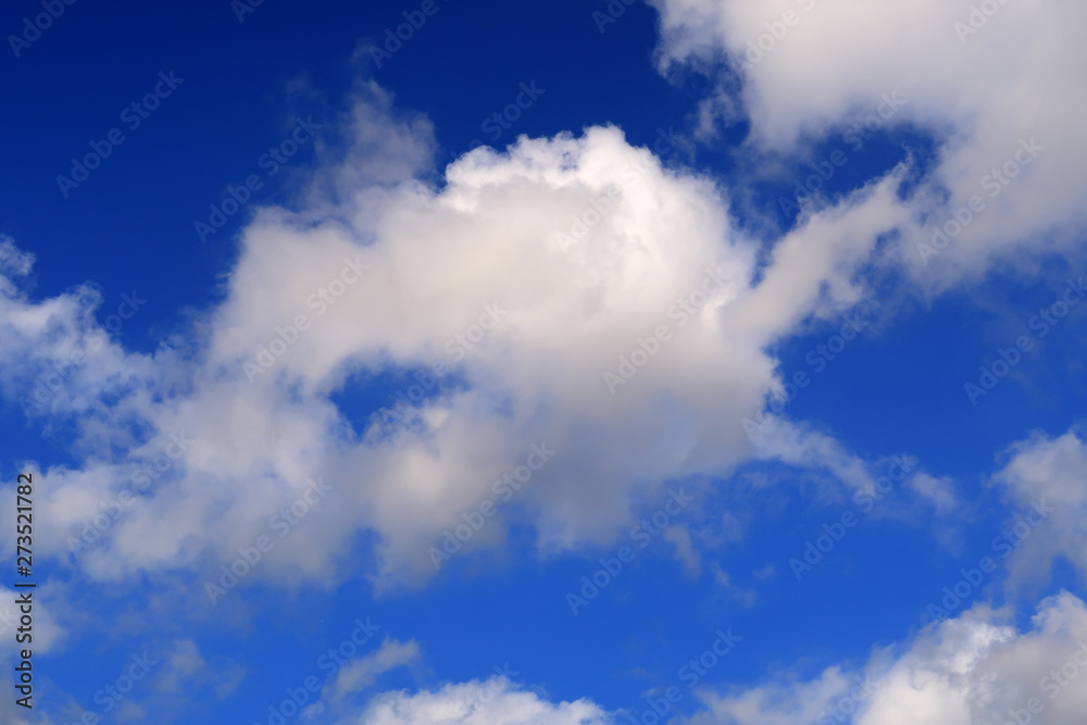 hisps of white clouds in a deep blue sky hisps of white clouds in a deep blue sky