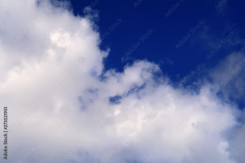 Large clouds across a blue sky Large clouds across a blue sky