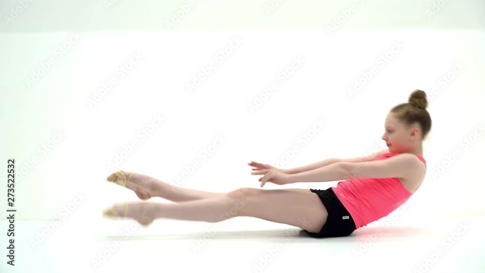 The gymnast perform an acrobatic element on the floor. The gymnast perform an acrobatic element on the floor.