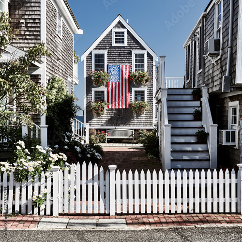 United States flag at suburban neighborhood. Provincetown, Cape Cod, Massachusetts, USA.