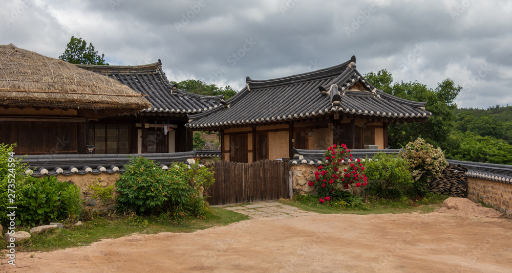 Typical korean traditional style country side buildings with farmyard in Yangdong Folk Village in typical landscape. Gyeongju, South Korea, Asia.
