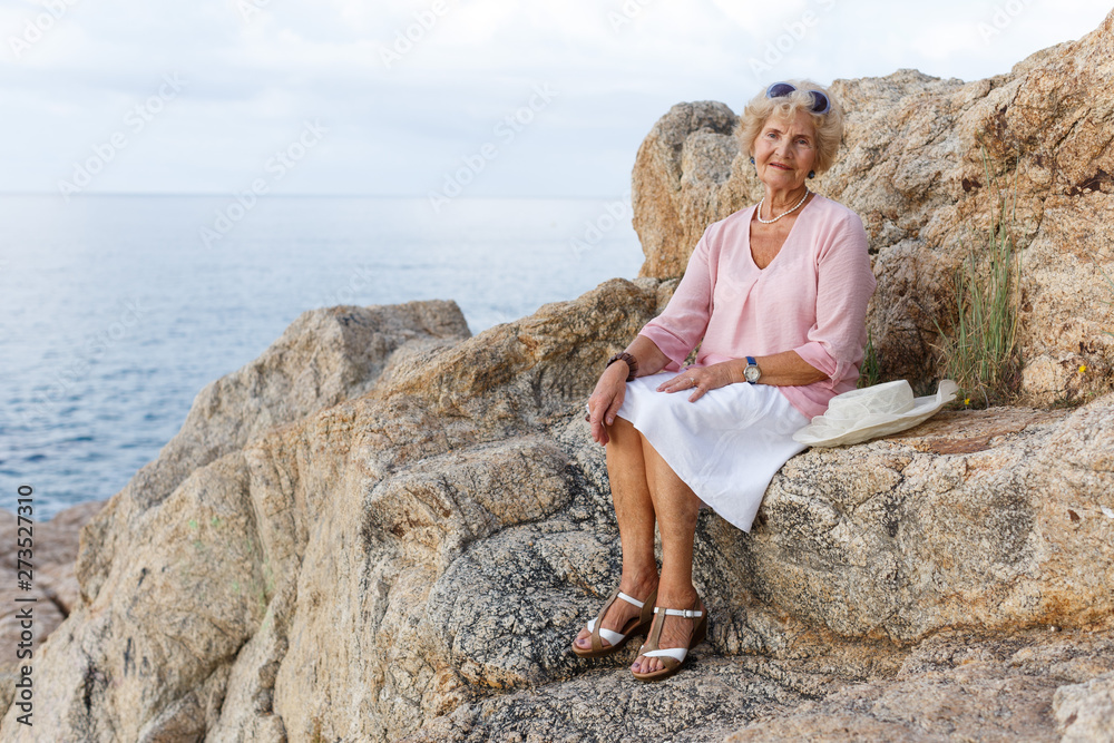 Senior woman relaxing at seaside