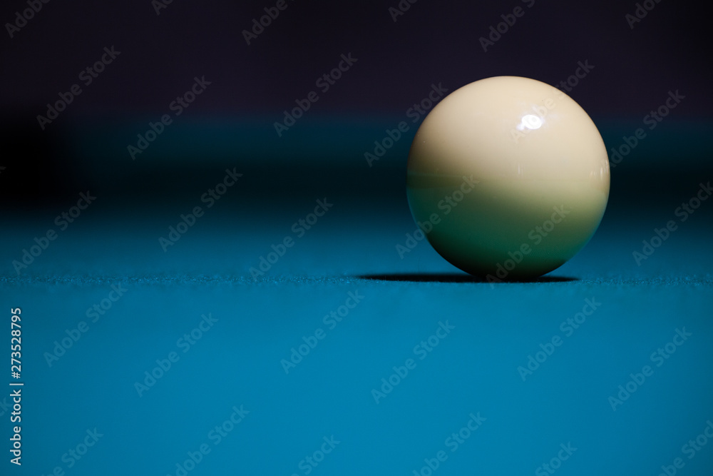 Pool white ball alone in table with blue felt Stock Photo Adobe Stock