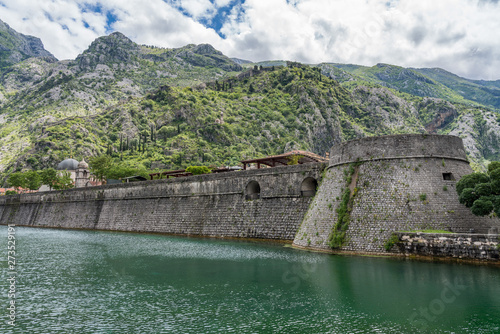 Solid stone walls surround the old town Kotor in Montenegro © steheap