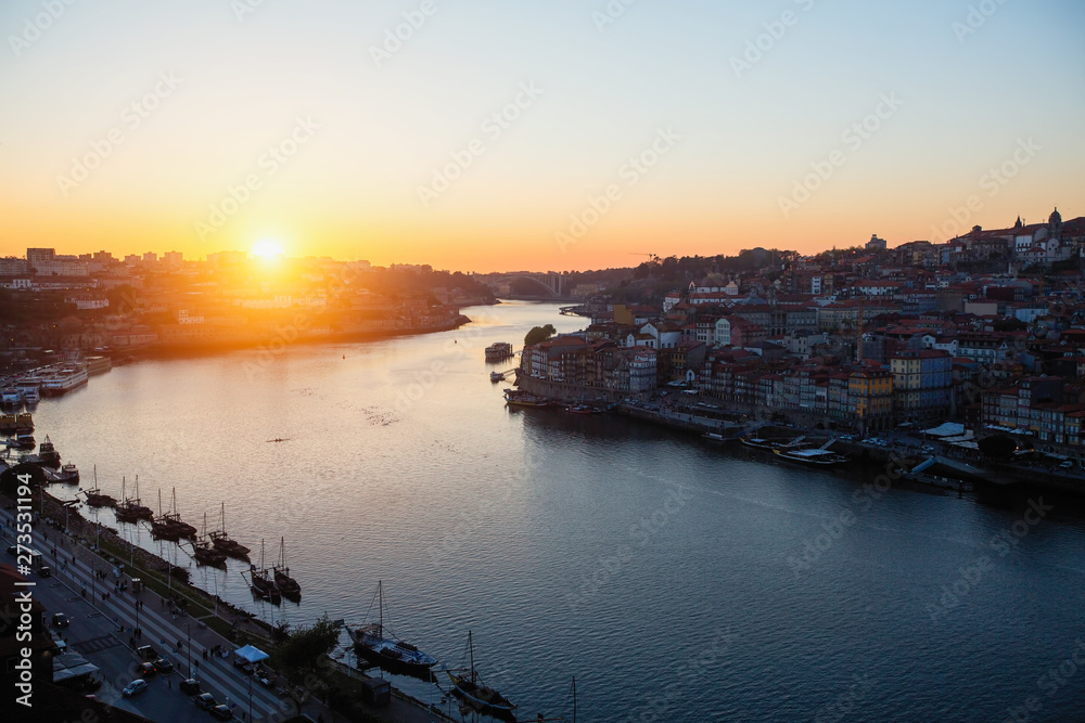 View of Douro river from Dom Luis I bridge at sunset, Porto, Portugal.