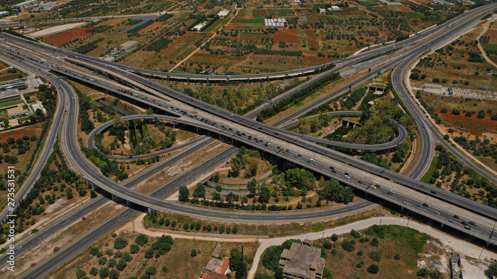 Aerial photo of multilevel junction highway crossing with high speed national road at rush hour Aerial photo of multilevel junction highway crossing with high speed national road at rush hour