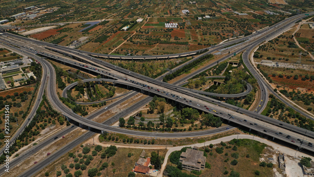 Aerial photo of multilevel junction highway crossing with high speed national road at rush hour Aerial photo of multilevel junction highway crossing with high speed national road at rush hour