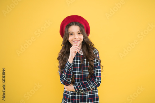 Teenage fashion. French fashion. Child small girl happy smiling baby. Happy childhood. Pure beauty. Kid little cute fashion girl posing with long hair and hat. Fashion girl. Fashionable accessory