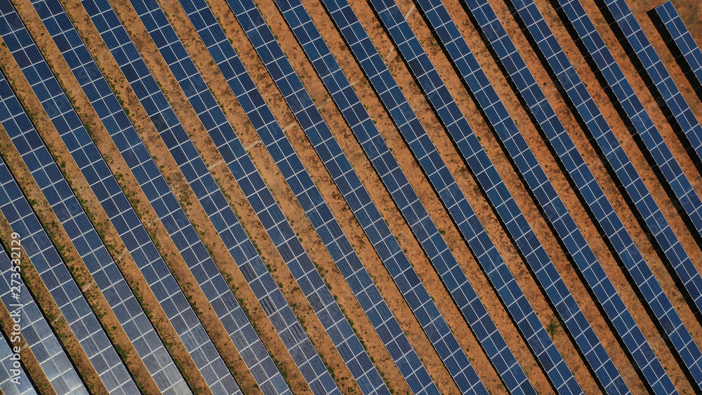 Aerial top view photo of solar panels as seen in ecological park out in the fields Aerial top view photo of solar panels as seen in ecological park out in the fields