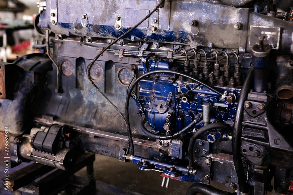 Mechanic opened the locking valve mechanism. Disassemble engine block vehicle. Old motor capital repair. Car service concept Mechanic opened the locking valve mechanism. Disassemble engine block vehicle. Old motor capital repair. Car service concept