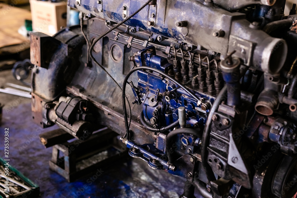 Mechanic opened the locking valve mechanism. Disassemble engine block vehicle. Old motor capital repair. Car service concept Mechanic opened the locking valve mechanism. Disassemble engine block vehicle. Old motor capital repair. Car service concept