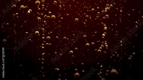 Transparent bubbles go up underwater over soda background
