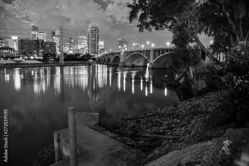 urban skyline along the river at night