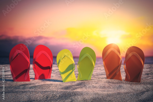 Bright flip flops on beach