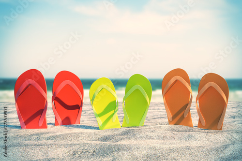 Colorful flip flops on beach