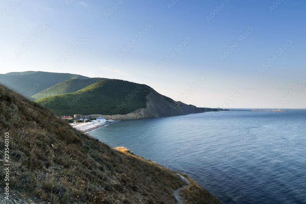 Obraz premium Early morning. The view from the mountain with grass on the beach in the village of Sukko. Suburb of Anapa, Krasnodar region.
