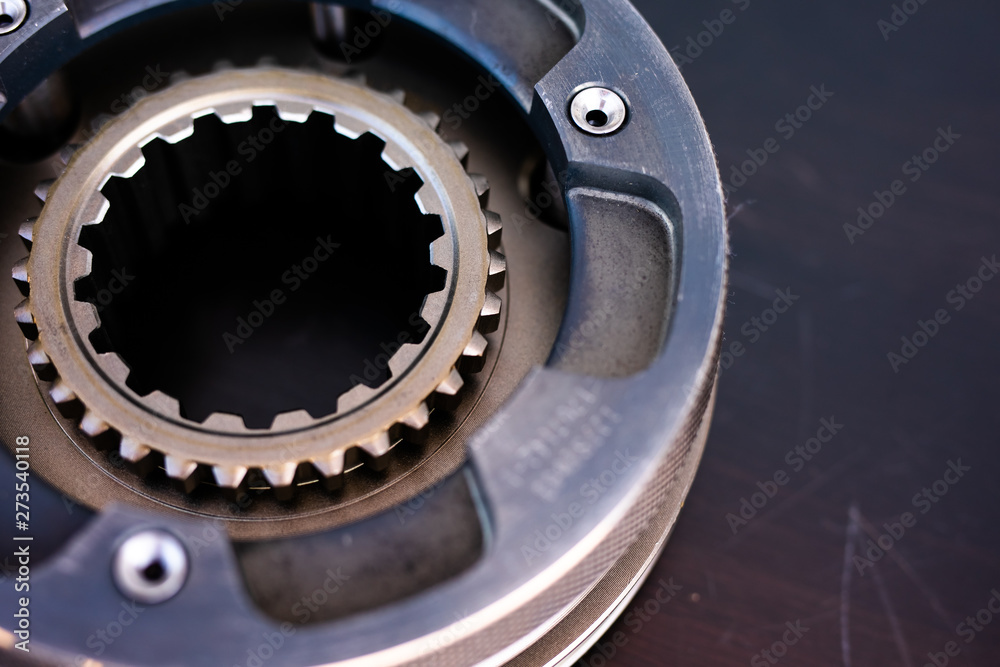 Mechanic repairs old motor of truck in a car repair station. Disassemble engine block vehicle. New details for motor. Car service concept Mechanic repairs old motor of truck in a car repair station. Disassemble engine block vehicle. New details for motor. Car service concept