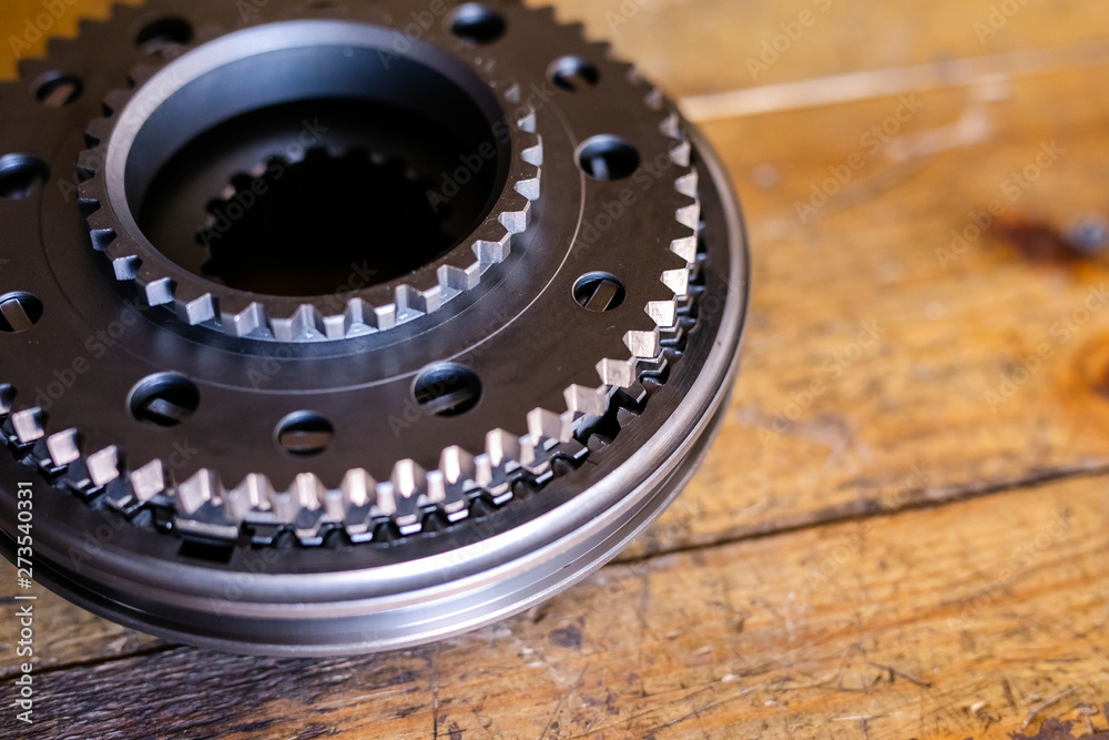 Mechanic repairs old motor of truck in a car repair station. Disassemble engine block vehicle. New details for motor. Car service concept Mechanic repairs old motor of truck in a car repair station. Disassemble engine block vehicle. New details for motor. Car service concept