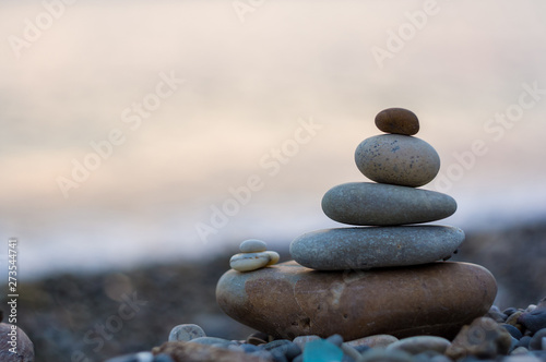 stack of zen stones on pebble beach