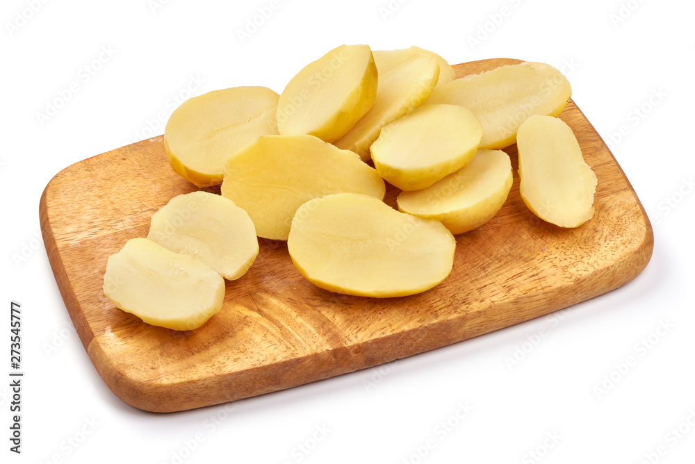 Boiled potato pieces on a cutting board, close-up, isolated on white background