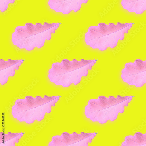Neon illustrated seamless pattern with pink leaves on yellow background © Elena Arsenteva