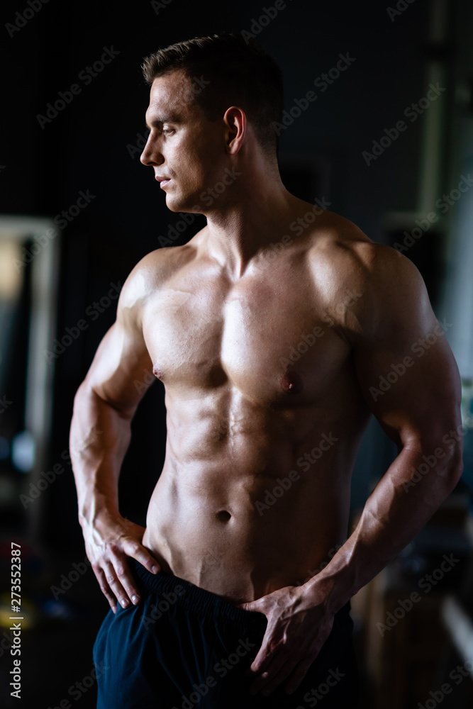 Strong, fit and sporty bodybuilder man over black background. Strong, fit and sporty bodybuilder man over black background.