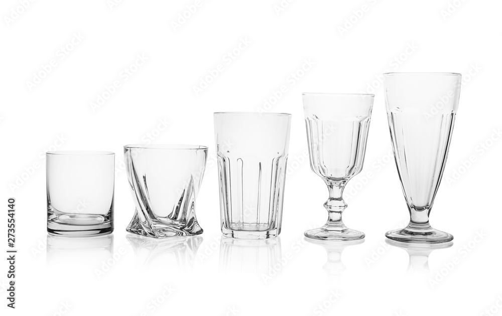 Set of empty glasses for different drinks on white background Set of empty glasses for different drinks on white background