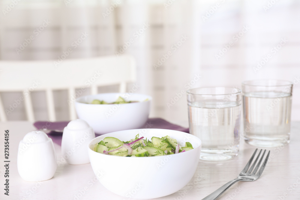 Delicious fresh cucumber onion salad served on table Delicious fresh cucumber onion salad served on table
