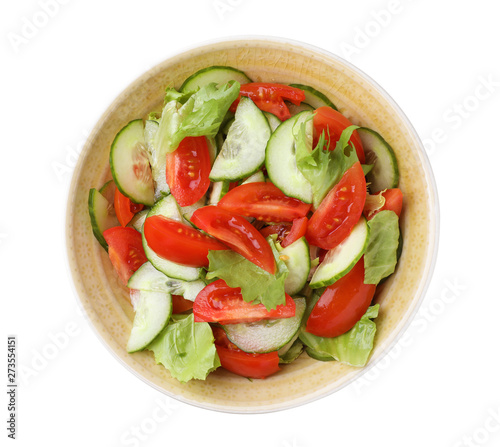 Delicious fresh cucumber tomato salad in bowl on white background, top view