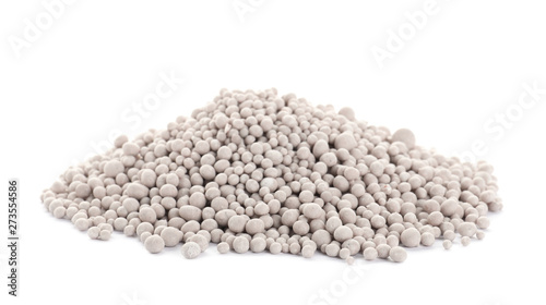 Pile of chemical fertilizer isolated on white. Gardening time photo