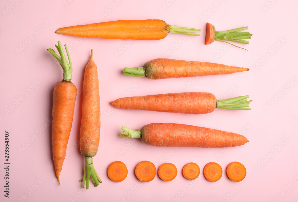 Flat lay composition with fresh carrots on color background Flat lay composition with fresh carrots on color background