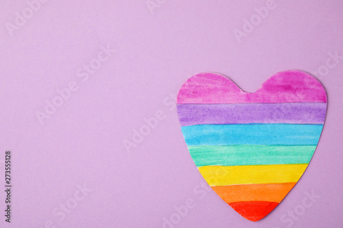 Top view of rainbow heart on color background, space for text. Gay symbol © New Africa