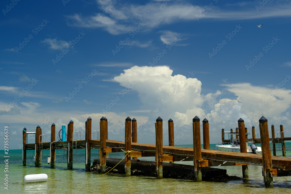 Wooden boat dock in very shallow waters in the Florida Keys