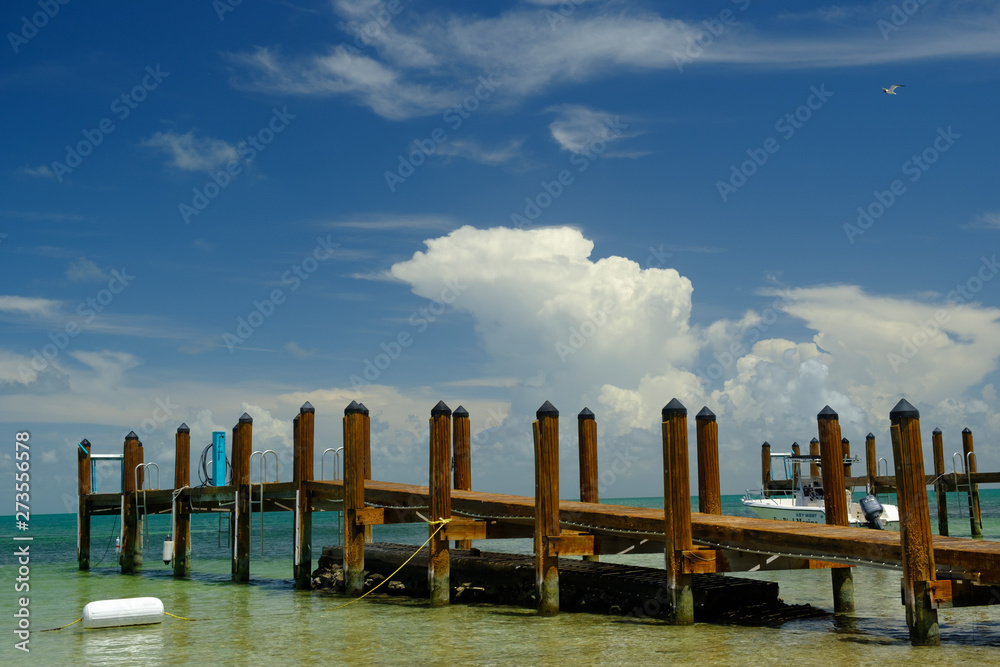 Wooden boat dock in very shallow waters in the Florida Keys Wooden boat dock in very shallow waters in the Florida Keys