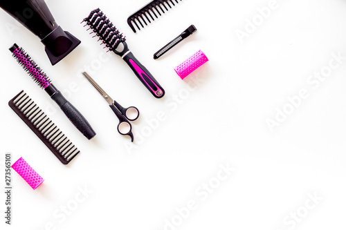 Fototapeta Naklejka Na Ścianę i Meble -  Set of professional hairdresser tools with combs and drier on white background top view mock up