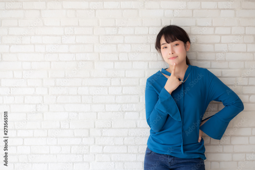 Beautiful portrait young asian woman confident thinking with cement and concrete background, girl standing expression serious or doubts with idea, lifestyle concept. Beautiful portrait young asian woman confident thinking with cement and concrete background, girl standing expression serious or doubts with idea, lifestyle concept.