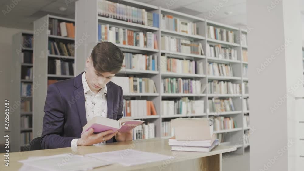 Serious Student Searching Information in Book in Library