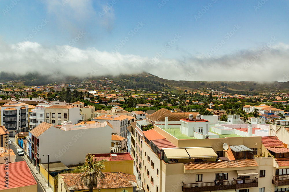 Fototapeta premium Aerial view of the historic town of San Cristobal de La Laguna in Tenerife showing the buildings and streets with mountains in the background