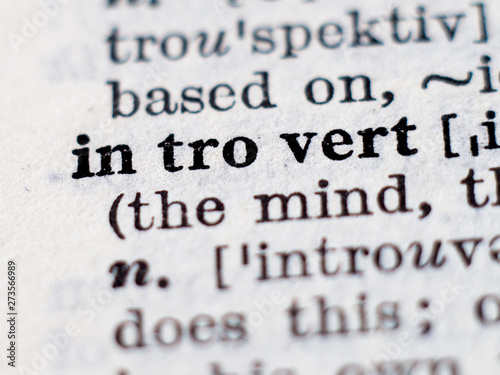Dictionary definition of word introvert. Selective focus.