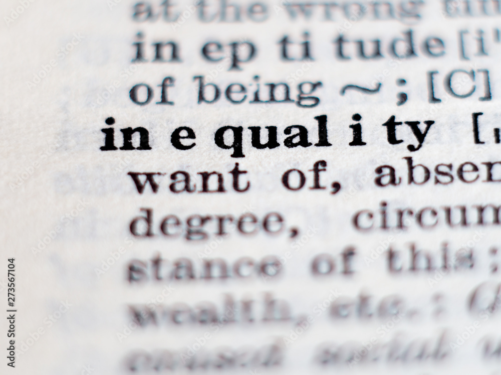 Dictionary definition of word inequality. Selective focus. Dictionary definition of word inequality. Selective focus.