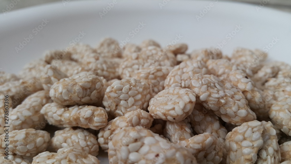 Closeup view of home made Asian sweet feed rewri or rewdi Closeup view of home made Asian sweet feed rewri or rewdi