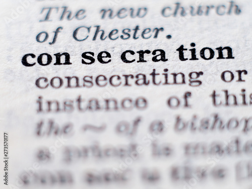 Tableau sur toile Dictionary definition of word consecration. Selective focus.