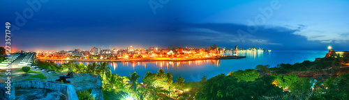 panoramic view of the city of habana and its bay seen from the castle of morro at nightfall photo