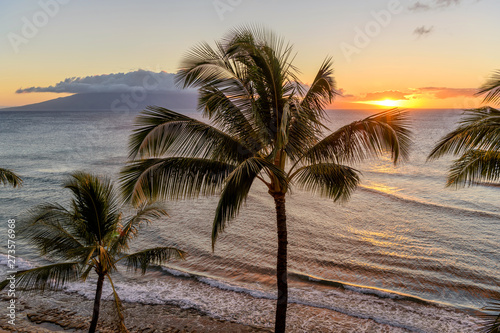 Sunset Island - A colorful sunset at north-west coast of Maui island  with Lanai island at horizon. Maui  Hawaii  USA.