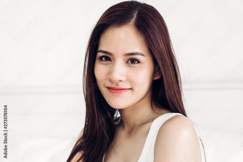 Portrait of asia woman enjoy and relax on the bed in bedroom at home.asian beauty Portrait of asia woman enjoy and relax on the bed in bedroom at home.asian beauty