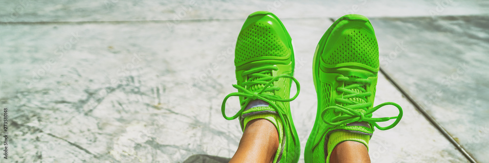 Green running shoes fashion footwear sportswear girl taking selfie of her  trainers panoramic banner. Stock Photo | Adobe Stock