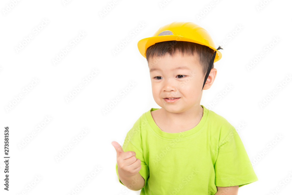 Little Asian toddler boy playing wood blocks wear helmet engineer Little Asian toddler boy playing wood blocks wear helmet engineer