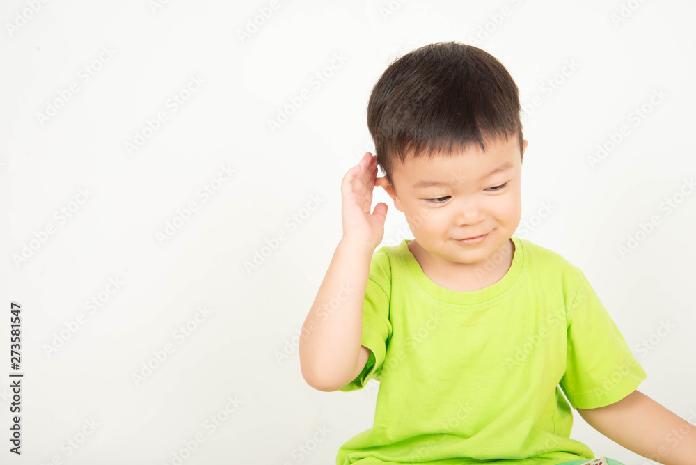 Little Asian toddler boy playing wood blocks wear helmet engineer Little Asian toddler boy playing wood blocks wear helmet engineer